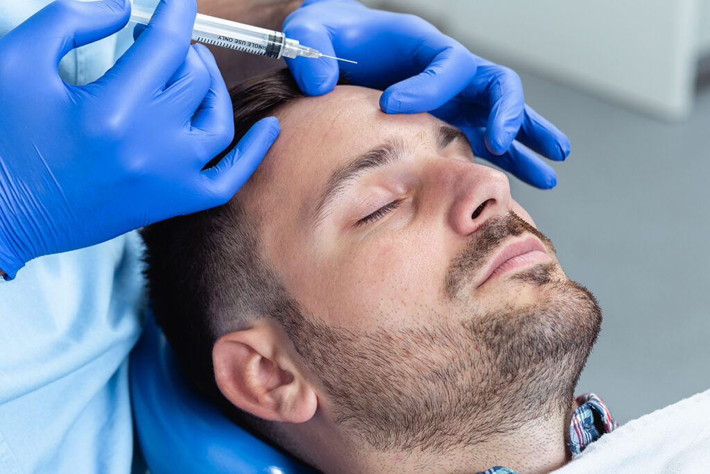 Injectable services - Man getting injectable to his scalp